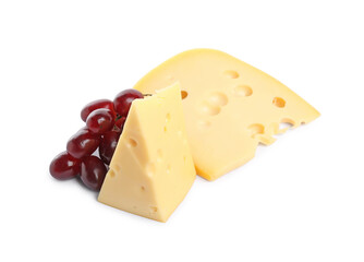 Pieces of delicious cheese and grapes isolated on white