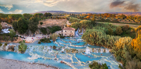 Most famous natural thermal hot spings pools in Tuscany - scenic Terme di Mulino vecchio ( Thermals of Old Windmill) in Grosseto province. high angle drone shoot - 724008963