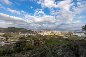 Fototapeta na wymiar View from the mountain to the city and coastal area