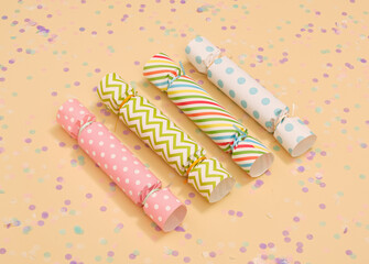 Colorful candy shaped gifts lying in a row. Holiday confetti.