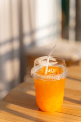 fresh orange juice in plastic glass