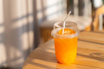 fresh orange juice in plastic glass
