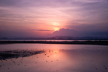 Dramatic sunset over mountain and sea.