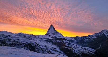 Beautiful view of famous Matterhorn mountain with amazing colorful twilight romantic sky in...
