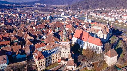Birds eye view over Sighisoara city. Aerial photography of medieval city of Sighisoara from...