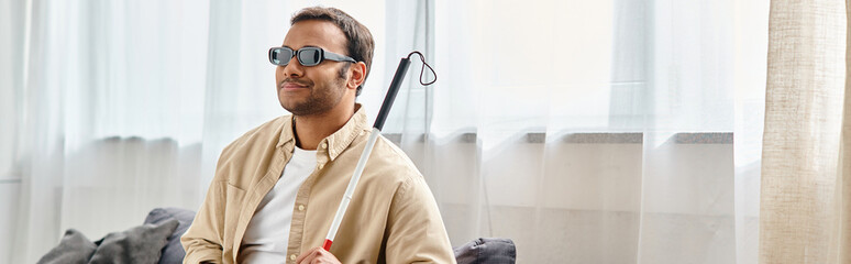 cheerful indian man with visual impairment in casual outfit with glasses and walking stick, banner