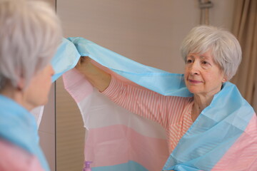 Proud senior human being supporting the trans cause  - obrazy, fototapety, plakaty