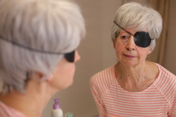 Senior woman wearing a black eyepatch
