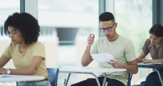 Man, assessment and confused for question in classroom, exam and university student studying. School, education and why at college, people learning and knowledge or information on test and report