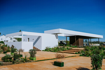 Sotogrande, Spain - January, 23, 2024 - Modern architecture with white cubic structures, flat...