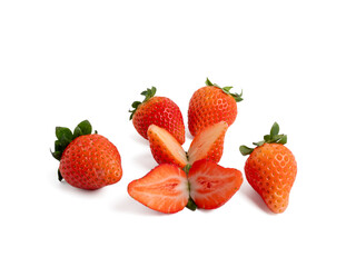 Strawberries cut in half and whole on a white background. Strawberries close up.