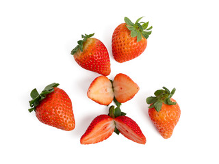 Strawberries cut in half and whole on a white background. Strawberries close up.