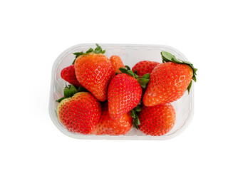 Strawberries in plastic packaging on a white background. Strawberries close up.