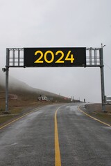 New year concept with the year 2024 on road. Happy New Year 2024 anniversary. 