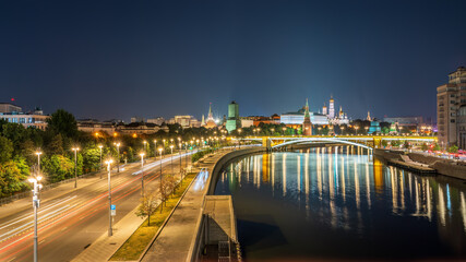 Illuminated Moscow Kremlin and Bolshoy Kamenny Bridge at summer night. View from the Patriarshy...