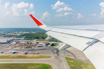 View from the airplane window during takeoff at Sheremetyevo airport at summer