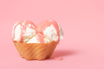 summer funny creative concept of cone with scoops of ice cream poured with icing on pink background, copy space