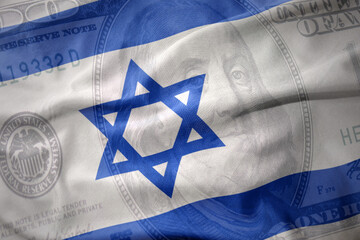 waving national flag of israel on a american dollar money background. finance concept.