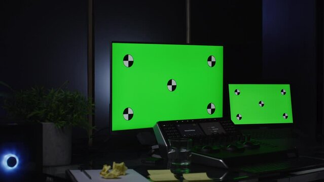 Color grading set up laptop and monitor with green screens