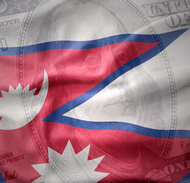 waving national flag of nepal on a american dollar money background. finance concept.