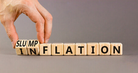 Inflation or slumpflation symbol. Concept word Inflation Slumpflation on beautiful wooden cubes. Beautiful grey background. Businessman hand. Business inflation slumpflation concept. Copy space.