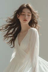 Fototapeta na wymiar A woman elegantly adorned in a flowing white long dress