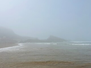 foggy ocean coast, fog at the ocean beach