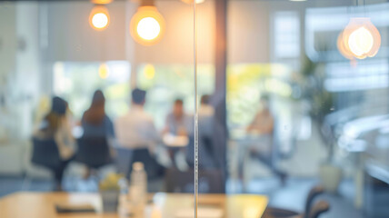 Fototapeta premium Blurred Bakcground View of a Business Team Meeting in a Modern Office
