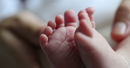 Baby newborn feet together, infant foot