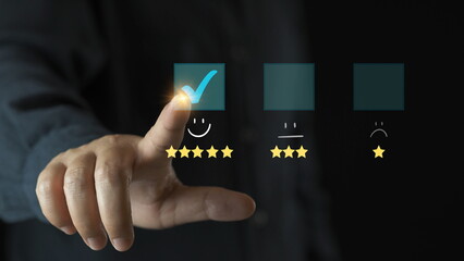Customer service and Satisfaction concept, Business people touching the virtual screen on the happy Smile face icon to give satisfaction in service. rating very impressed.