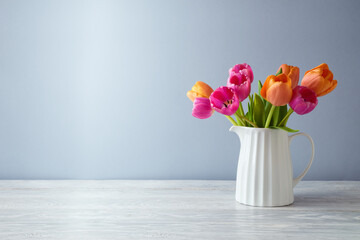 Beautiful tulip flower bouquet on white wooden table. Spring mock up for design and product display - 724107955