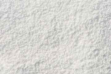 Fototapeta premium Abstract background from the surface of snow, top view.