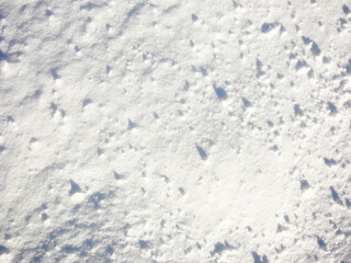 Snowy surface top view in bright weather.
