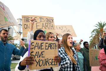 Group of diverse activists people at a demonstration against pollution and factories angrily...