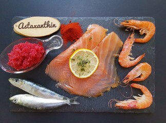 Foods rich in astaxanthin. Seafoods as natural sources of astaxanthin: salmon, caviar, shrimps,...