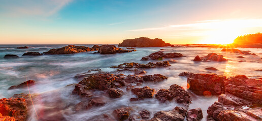 Rocky Shore on Pacific Ocean West Coast during Sunny Sunset. Vancouver Island