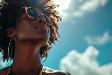 bottom view, Beautiful african american Woman with sunglasses under Sun, Summer Vacation, blue sky - obrazy, fototapety, plakaty