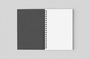 Black spiral notebook mockup with blank white inside.