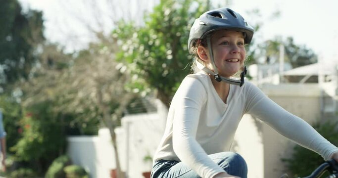 Father, child and teaching bicycle ride for safety, helmet and outdoor street for learning. Cycling, childhood memory and riding in summer, bonding together and recreation with girl, proud and happy