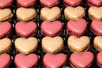 Traditional french baked pastry, heart shaped macaroons with vanilla and raspberry favor.