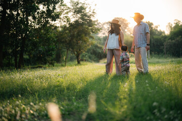 happy harmonious Asian family outdoors concept, Asian mother and son have activities happy fun...