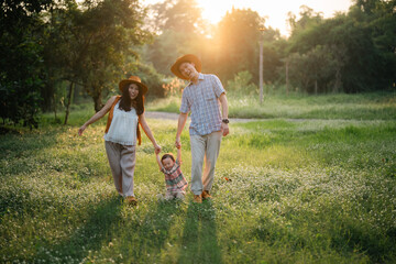 happy harmonious Asian family outdoors concept, Asian mother and son have activities happy fun...