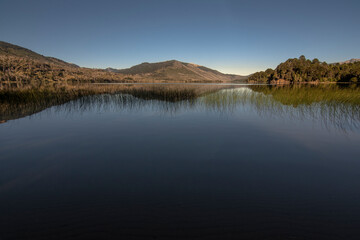 landscape of north-west Patagonia Argentina at noon. mirror like lake. Neuquén