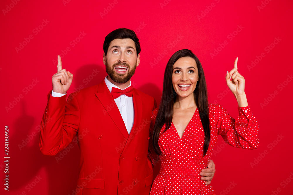 Aufkleber photo of classy handsome guy attractive lady cuddle look indicate fingers up empty space ad isolated