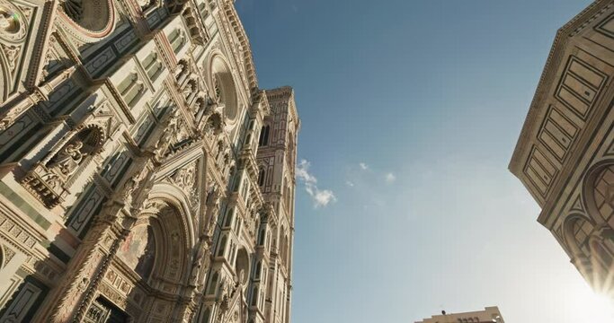 The facade of the Basilica of Santa Maria del Fiore in Florence, Italy. Cityscape of an ancient city with a cathedral with historical architecture in the tourist center of Europe. High quality 4k 