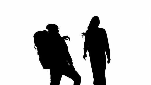 Black silhouette of a man reaching out to a woman while climbing. A couple rejoicing in shared success, high fiving each other. Tourists, man and woman on white isolated background.