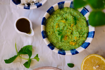 Green pea dip with feta and crostini. top view .