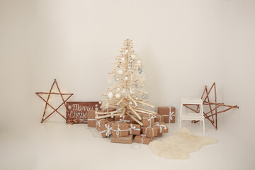 New Year's decorations on a white background. wooden Christmas tree. craft Christmas gifts....