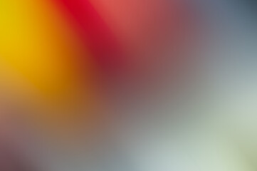 Pink, red, yellow on light - blurry abstract background.