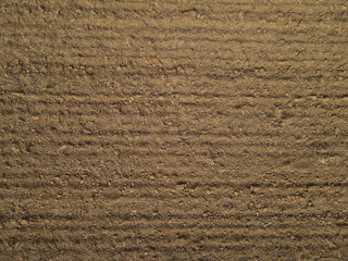 Brown farm field with soil 